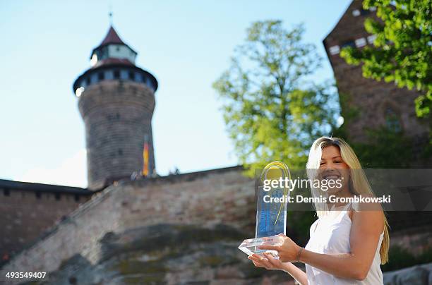 Eugenie Bouchard of Canada poses at Nuremberg Castle after winning the Nuernberger Versicherungscup in her final against Karolina Pliskova of Czech...