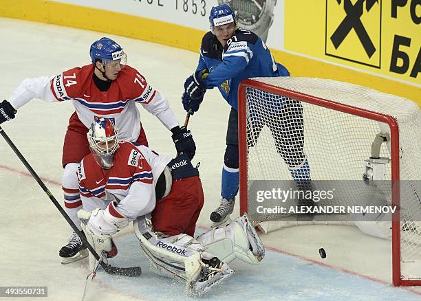 Finland's forward Jori Lehtera scores past Czech Republic's goalie Alexander Salak as Czech Republic's defender Ondrej Vitasek tries to stop him...