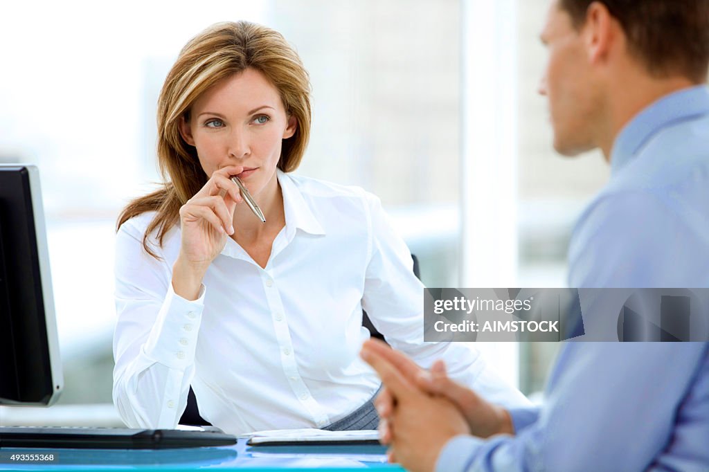 Manager listening to businessman