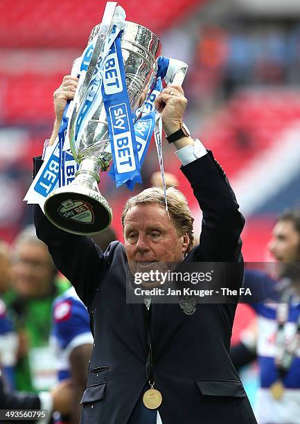 Manager of QPR Harry Redknapp celebrates with the trophy during the Sky Bet Championship playoff final match between Derby County and Queens Park...