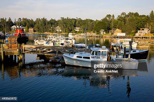 lobster boats docked in southport at sunset, maine - southport maine stock pictures, royalty-free photos & images