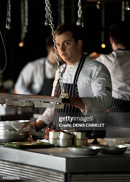 French head chef of the Grenouillère restaurant Alexandre Gauthier works in his kitchen in La Madelaine-sous-Montreuil on October 16, 2015. Alexandre...