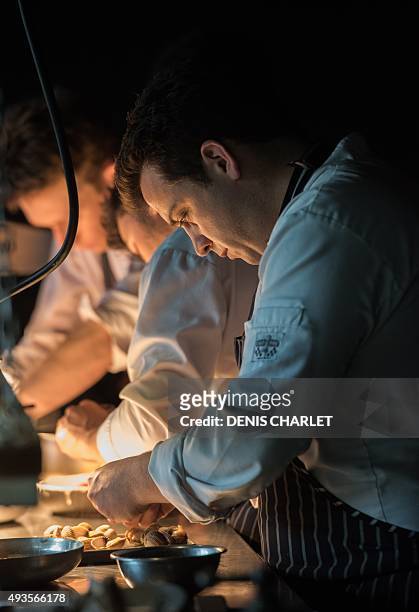 French head chef of the Grenouillère restaurant Alexandre Gauthier works in his kitchen in La Madelaine-sous-Montreuil on October 16, 2015. Alexandre...