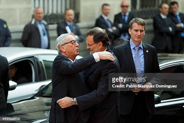 European Commission President Jean-Claude Juncker hugs Spanish Prime Minister Mariano Rajoy as he arrives to the Premio Nueva Economia Forum 2015...