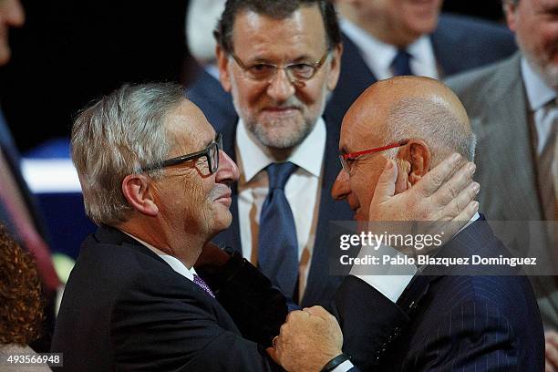 European Commission President Jean-Claude Juncker meets Leader of Unio political party Josep Antoni Duran i Lleida on stage as Spanish Prime Minister...