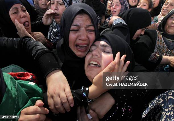 One of the two wives of Udai al-Masalmeh, a Palestinian man who was shot dead after he carried out a stabbing attack on an Israeli soldier during...