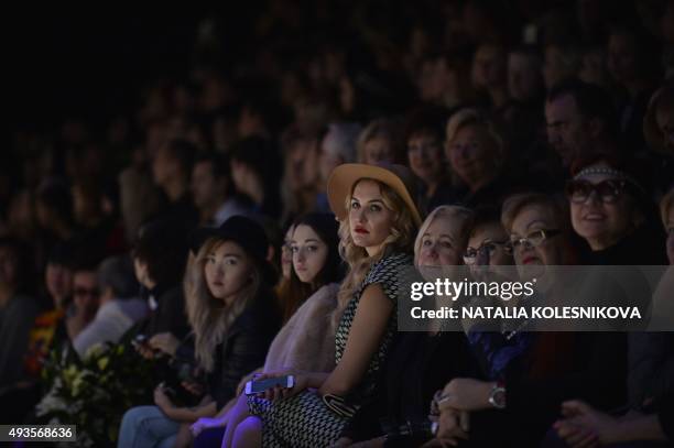 People attend a fashion show by Russian designer Slava Zaitsev during the Mercedes-Benz Fashion Week Russia in Moscow on October 21, 2015. AFP PHOTO...