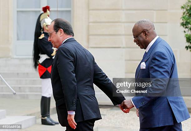 French President Francois Hollande welcomes Malian President Ibrahim Boubacar Keita at the Elysee Presidential Palace on October 21, 2015 in Paris,...