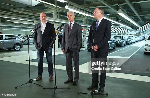 New Volkswagen Group Chairman Matthias Mueller , Volkswagen Work Council head Bernd Osterloh and Lower Saxony Governor Stephan Weil speak to the...