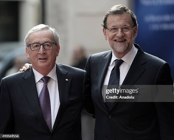 Spanish Prime Minister Mariano Rajoy welcomes the European Commission President Jean-Claude Juncker before offering the Nueva Economia Forum Award to...