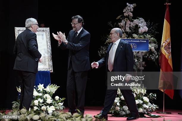 Spanish Prime Minister Mariano Rajoy offers the Nueva Economia Forum Award to the European Commission President Jean-Claude Juncker during the Premio...