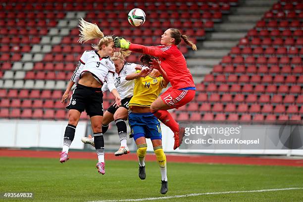 Nina Ehegoetz and Madeline Gier of Germany and Anna Oskarsson and Matilda Haglund of Sweden fight for the ball during the Women's International...