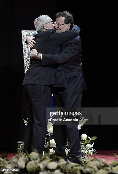 Spanish Prime Minister Mariano Rajoy offers the Nueva Economia Forum Award to the European Commission President Jean-Claude Juncker during the Premio...