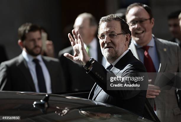 Spanish Prime Minister Mariano Rajoy leaves after offering the Nueva Economia Forum Award to the European Commission President Jean-Claude Juncker at...