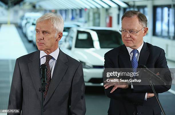 New Volkswagen Group Chairman Matthias Mueller and Lower Saxony Governor Stephan Weil speak to the media while standing at the assembly line of the...