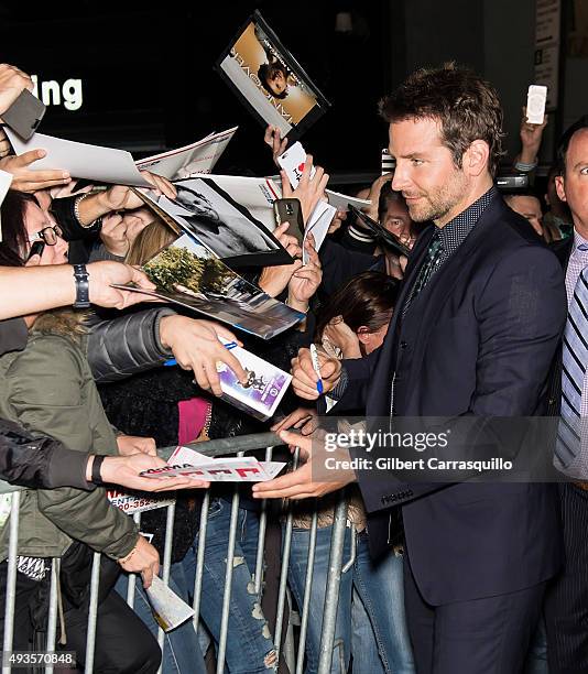 Actor Bradley Cooper greets fans at the 'Burnt' New York Premiere at Museum of Modern Art on October 20, 2015 in New York City.