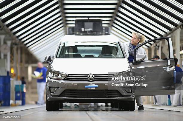 Worker prepares a finished Volkswagen car for transport at the end of the assembly line prior to a visit by Volkswagen Group Chairman Matthias...
