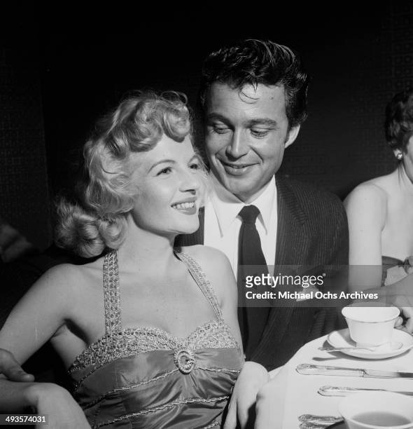French actress Corinne Calvet with Jeffrey Stone attends a premiere in Los Angeles, California.