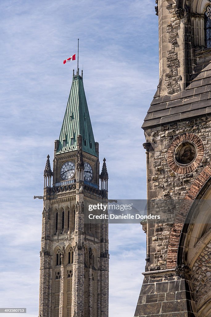 Canada's Peace Tower with flag at half mast