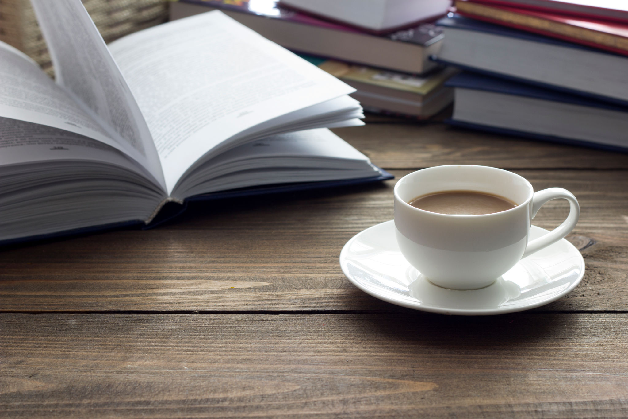 cup of coffee and a lot of books cup of coffee and a lot of books