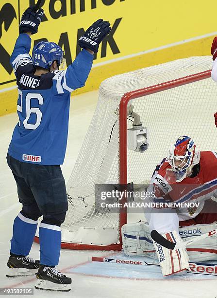 Finland's forward Jarkko Immonen scores past Czech Republic's goalie Alexander Salak during a semifinal game Czech Republic vs Finland of the IIHF...