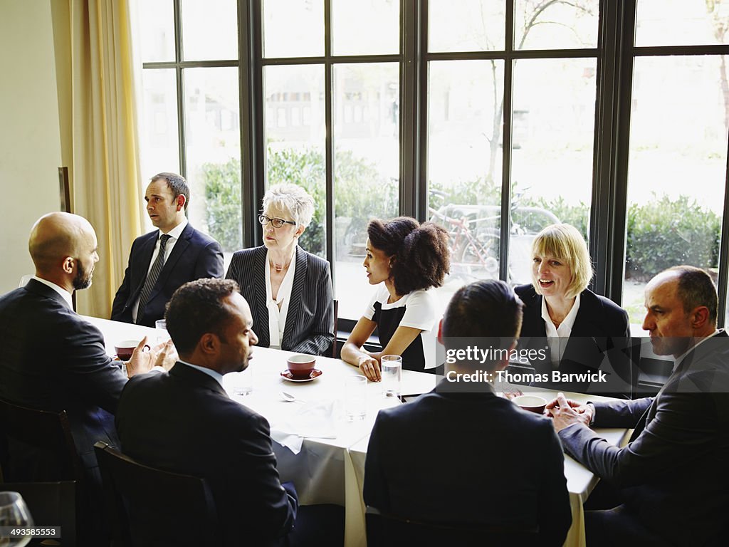Group of business people meeting in restaurant