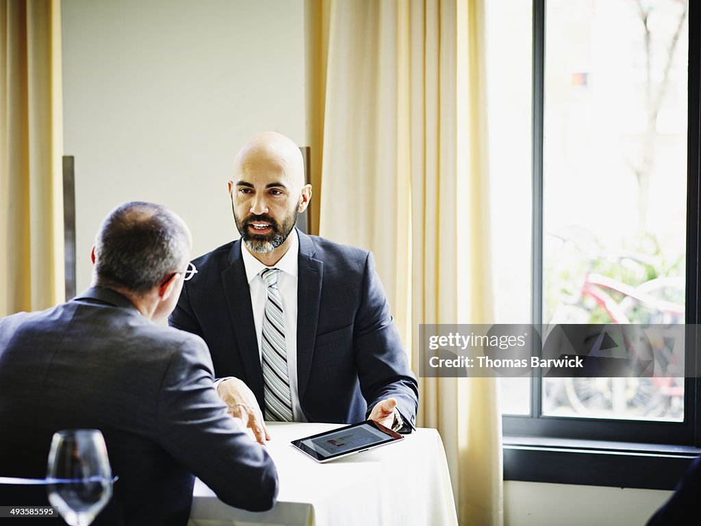 Businessman in meeting with client in restaurant