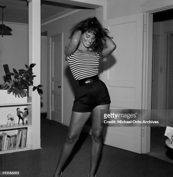 Jackie Collins poses at home in Los Angeles, California.
