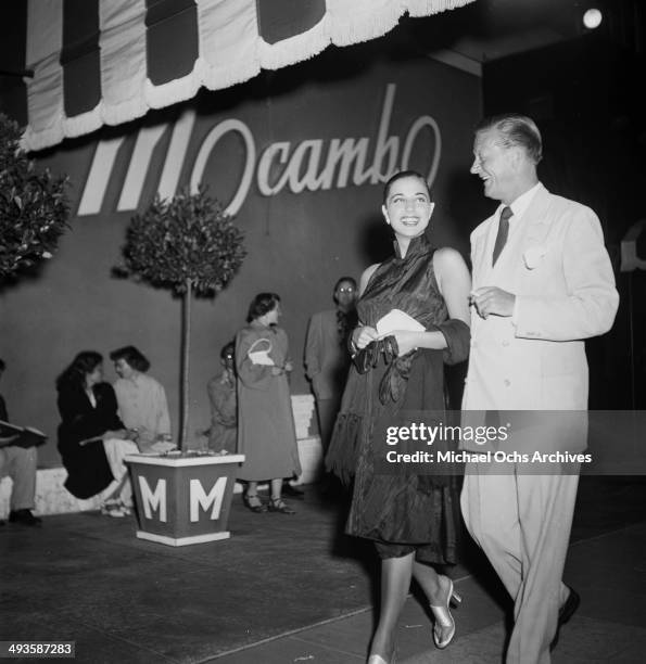 Italian actress Franca Faldini with Carleton Alsop arrive at Mocambo in Los Angeles, California.