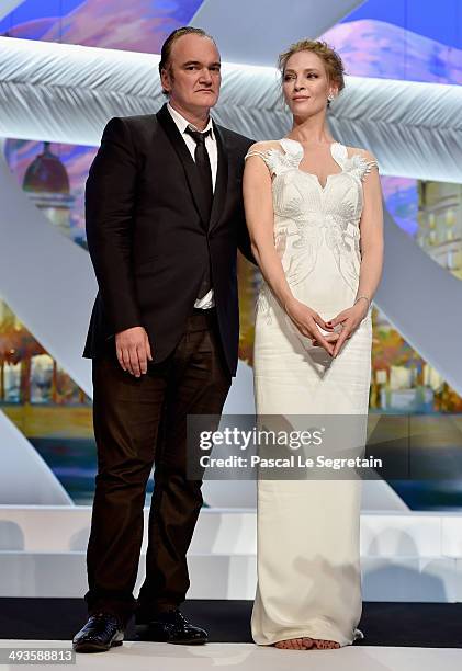 Director Quentin Tarantino and actress Uma Thurman appear on stage to give the Palme d'Or award during the Closing Ceremony at the 67th Annual Cannes...