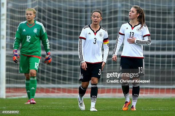 Carin Schlueter, Felicitas Rauch and Isabella Hartig of Germany #de2 after the first goal of Sweden during the Women's International Friendly match...