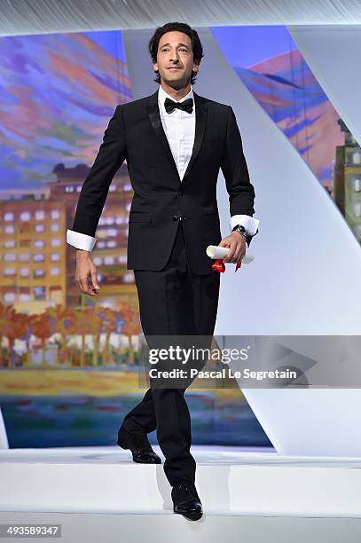 Actor Adrien Brody arrives on stage to present the Best Director award during the Closing Ceremony at the 67th Annual Cannes Film Festival on May 24,...