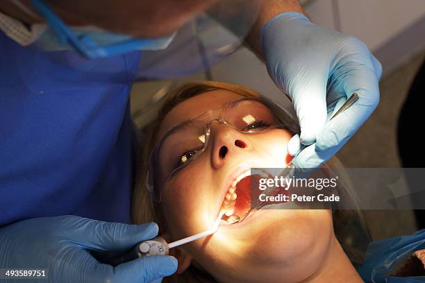 woman at dentist - dentistry stock pictures, royalty-free photos & images