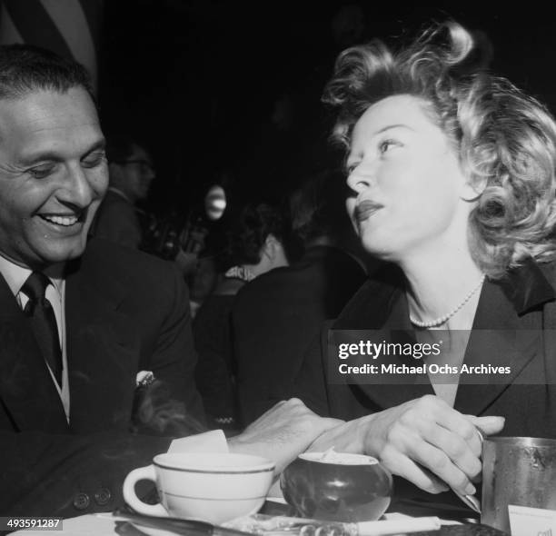 Actress Gloria Grahame with Cy Howard at Mocambo in Los Angeles, California.