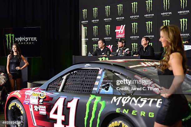 Tony Stewart, co-owner of Stewart-Haas Racing, speaks with the media as Kurt Busch, driver of the Stewart-Haas Racing Chevrolet, and Mitch Covington,...