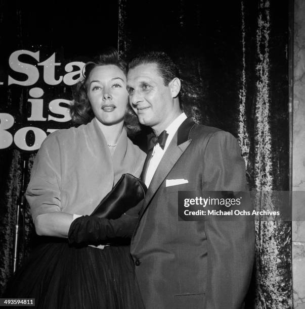 Actress Gloria Grahame with Cy Howard attends a party for"A Star Is Born" in Los Angeles, California.