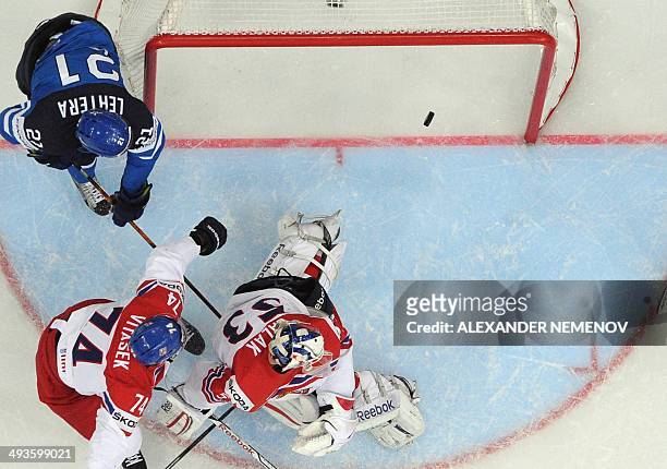 Finland's forward Jori Lehtera scores past Czech Republic's goalie Alexander Salak as Czech Republic's defender Ondrej Vitasek tries to stop him...