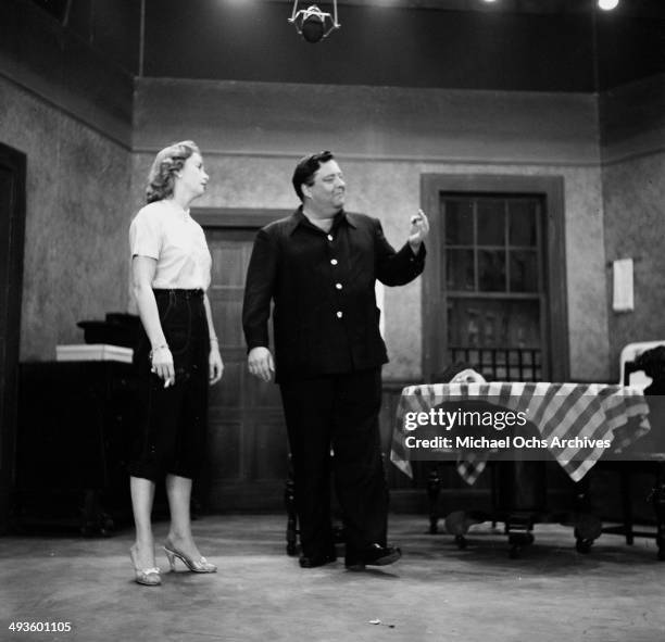 Actress Audrey Meadows and Jackie Gleason on stage during rehearsal of the "The Jackie Gleason Show" in Los Angeles, California.