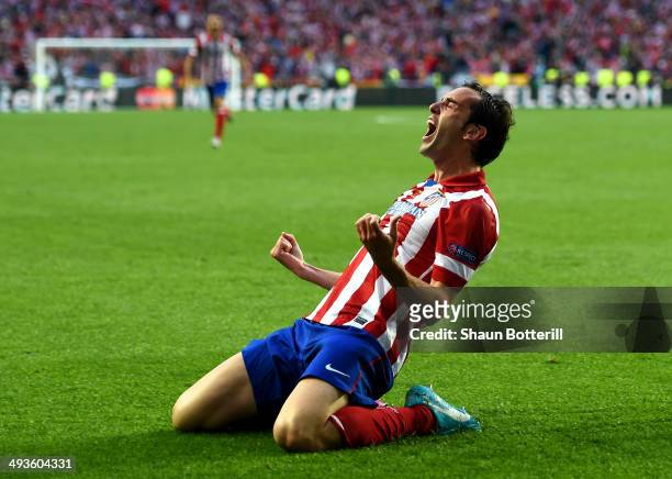 Diego Godin of Club Atletico de Madrid celebrates scoring the opening goal during the UEFA Champions League Final between Real Madrid and Atletico de...