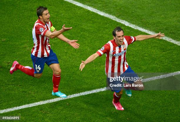 Diego Godin of Club Atletico de Madrid celebrates scoring the opening goal with Gabi of Club Atletico de Madrid during the UEFA Champions League...