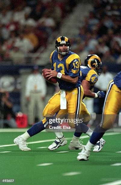 Kurt Warner of the St.Louis Rams moves back to pass the ball during a game against the Cleveland Browns at the Trans World Dome in St. Louis,...