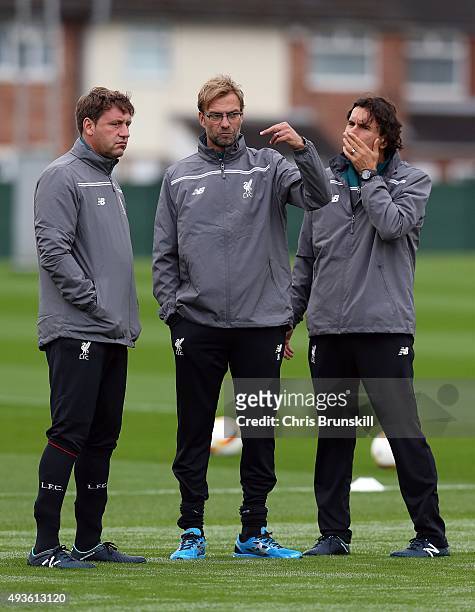 Liverpool manager Jurgen Klopp looks on next to his assistants Peter Krawietz and Zeljko Buvac during a Liverpool training session at Melwood...