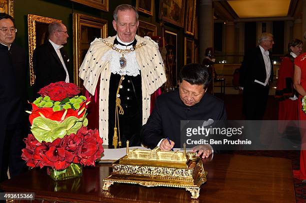 President Of The People's Republic Of China Xi Jinping signs the "Distinguished Visitors Book" during the Lord Mayors banquet at The Guildhall on...