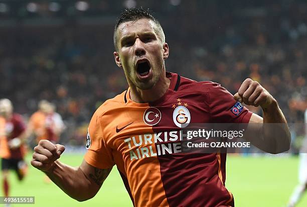 Galatasaray's German forward Lukas Podolski celebrates scoring during the UEFA Champions League football match between Galatasaray AS and SL Benfica...