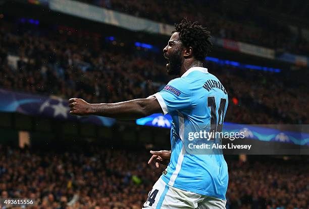 Wilfried Bony of Manchester City celebrates his teams opening goal, an own goal by Adil Rami of Sevilla during the UEFA Champions League Group D...