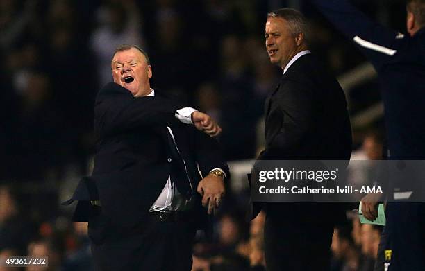 Kit Symons manager of Fulham looks over as Steve Evans manager of Leeds United reacts to a decision during the Sky Bet Championship match between...