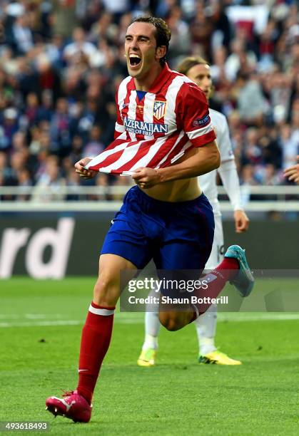 Diego Godin of Club Atletico de Madrid celebrates scoring the opening goal during the UEFA Champions League Final between Real Madrid and Atletico de...