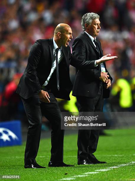 Head Coach, Carlo Ancelotti of Real Madrid looks on as Assistant coach Zinedine Zidane of Real Madrid as he shouts instructions during the UEFA...
