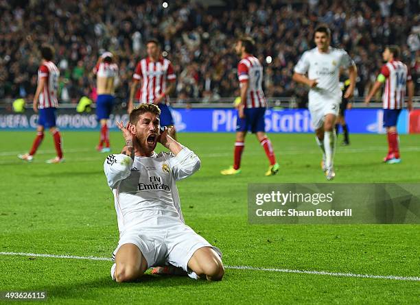 Sergio Ramos of Real Madrid celebrates scoring their first goal in stoppage time during the UEFA Champions League Final between Real Madrid and...