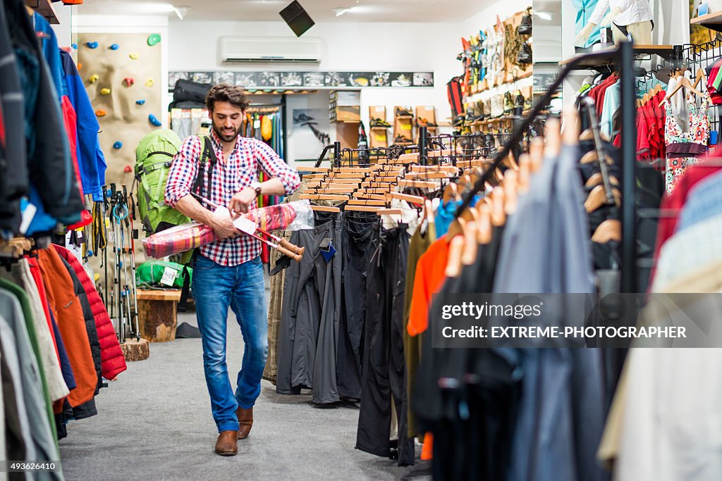 Male customer in outdoor equipment store